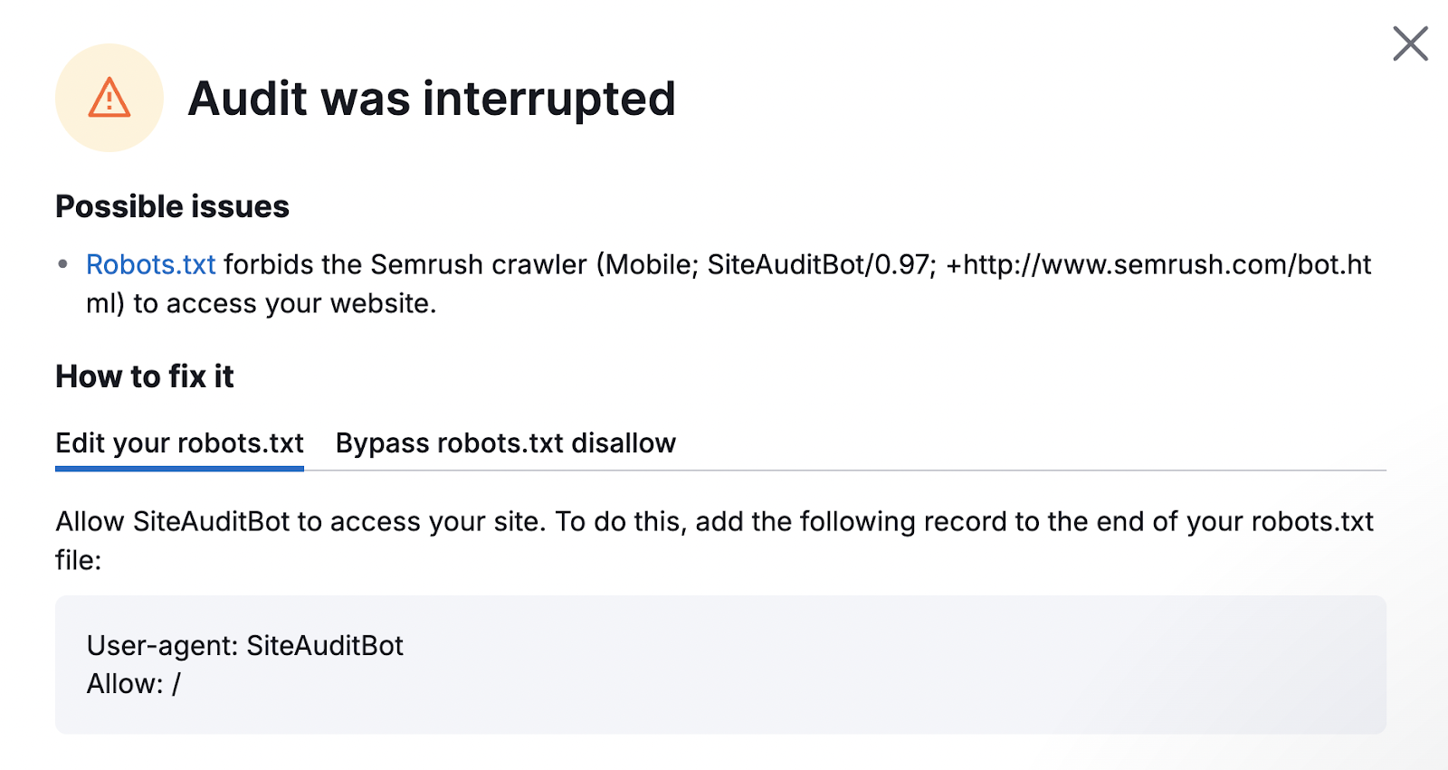 Warning shows the audit was interrupted because the robots.txt file forbids the crawler.